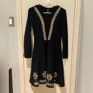 Black dress with golden motifs. Size L
